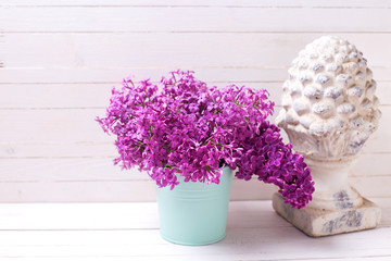Сolorful spring lilac flowers on white wooden background.
