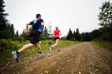 Joggers Training in Forest early in the Morning.