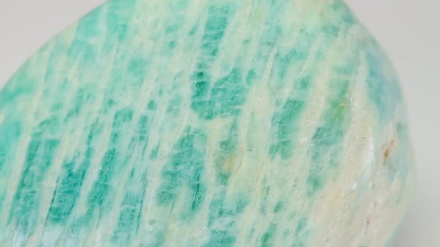 Amazonite or Amazon stone, green mineral  isolated on a white background