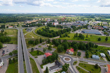 Naklejka premium Aerial photography. Small city landscape, amazing clouds.