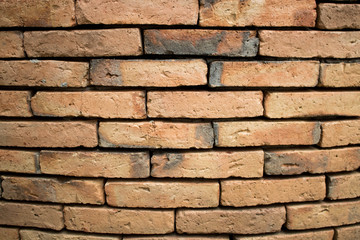 The background of the ancient brick wall is not very close together.