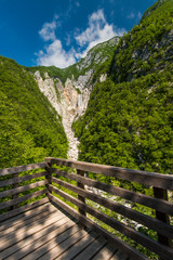 Fototapeta na wymiar Wooden deck overlooking Boka waterfall in Slovenia