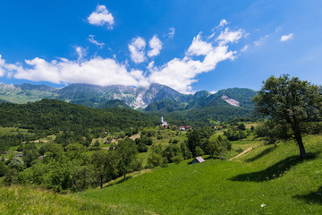 Fototapeta na wymiar Dreznica village at summer in Slovenia Alps
