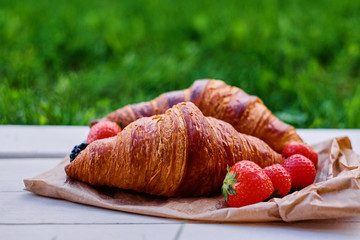 Delicious croissant with strawberry.