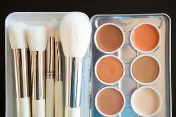 Make up and cosmetics products on black background. Professional Cosmetics