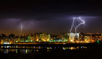 Thunderstorm in the city with lightnings