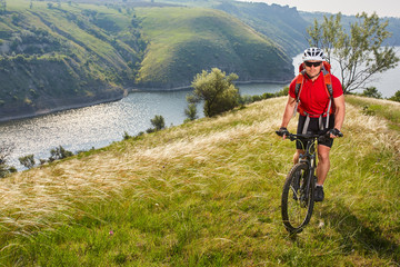 Fototapeta premium Traveler has adventur on meadow on riverside