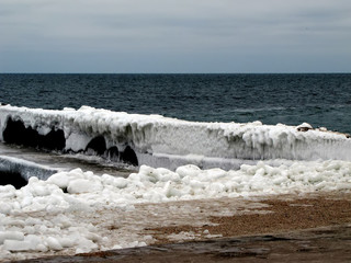 Frozen pier ashore sea in winter