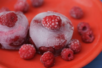 Frozen berry raspberry with white hoarfrost