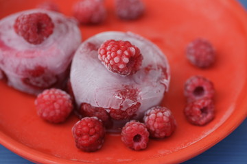 Frozen berry raspberry with white hoarfrost