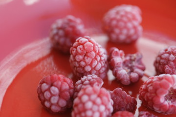 Frozen berry raspberry with white hoarfrost