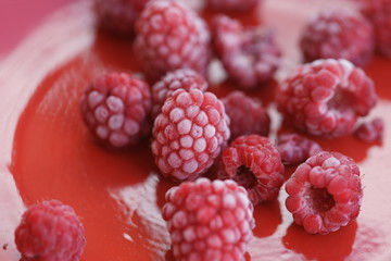 Frozen berry raspberry with white hoarfrost