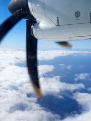 Naklejka na ściany i meble Propeller of the plane view from airplane window