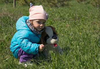 Girl with a toy dog