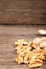 Walnuts on wooden background in studio photo