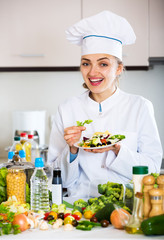 Portrait of professional chef with vegetables