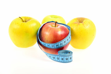 Apples and tape for measuring wrapped around one of them