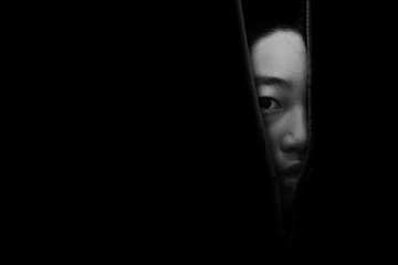 fear girl hiding in closet in white tone