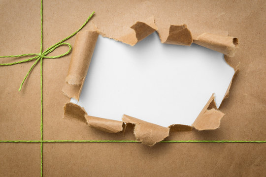 Package ripped on white background