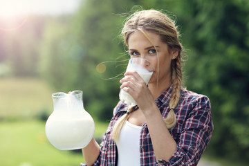 Young woman with fresh organic milk