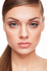Obraz premium Beautiful model with natural make-up on white background. Studio photo