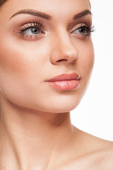 Obraz premium Beautiful model with natural make-up on white background. Studio photo