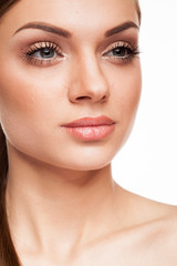 Obraz premium Beautiful model with natural make-up on white background. Studio photo
