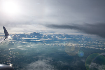 Sky and white clouds horizon view from airplane window