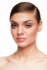 Fototapeta premium Gorgeous woman with natural make up on white background in studio photo