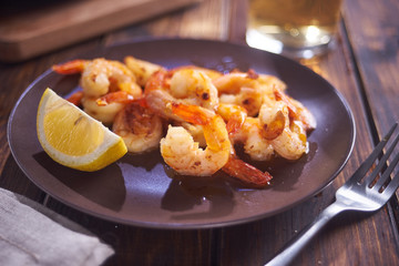 Fried shripms and glas on plate