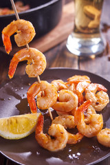 Shrimps on stick for barbecue.