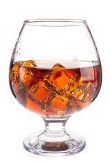 Brandy with ice in goblet, isolated on white background. Stock