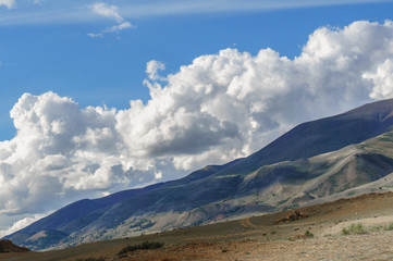 Fototapeta na wymiar Clouds over Altai steppe in summer