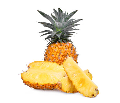 ripe whole and half pineapple with slice isolated on white background