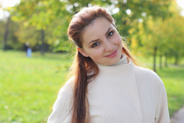 Fototapeta premium girl walking in the park in autumn