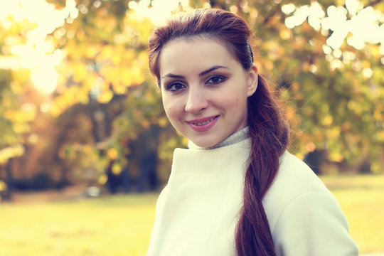 girl in a park walk autumn alone