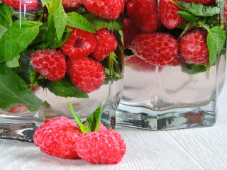 Bright mint drink with raspberries.