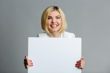 Young woman with blank sheet