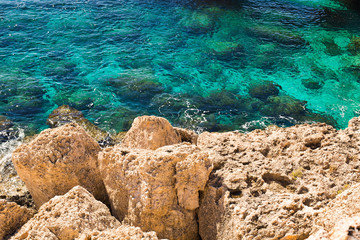 Rock cliffs and sea bay with azure water near Protaras, Cyprus island.