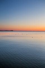 Amazing sunrise on the pier at the seaside. Gdynia Orlowo, Poland