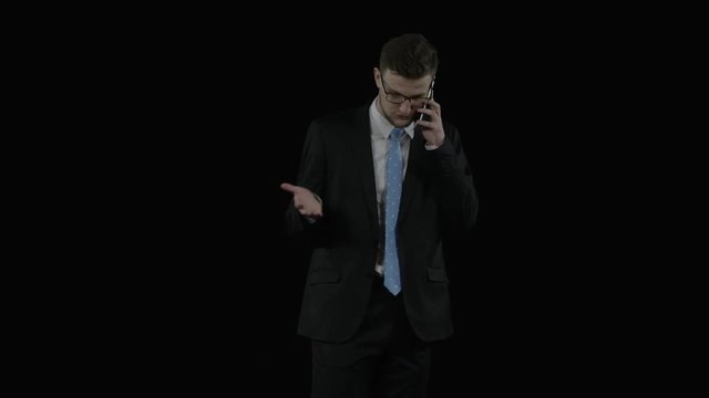 Caucasian young official speaks on the phone