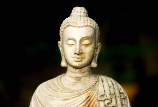 Close up Cream white head Buddha statue
