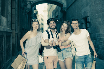 People taking promenade with suitcases