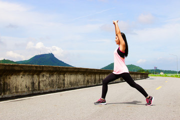 Woman is exercising at dam