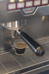 Fototapeta na wymiar Espresso machine brewing hot espresso