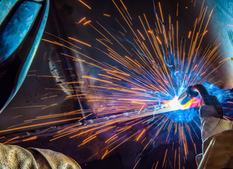 Industrial steel welder in factory