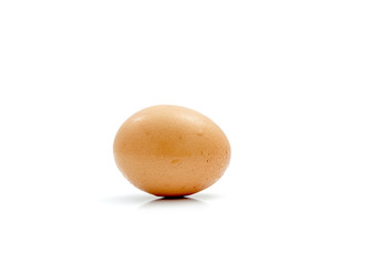 Single brown chicken egg isolated on white