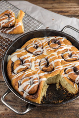 Cinnamon rolls on wooden plate
