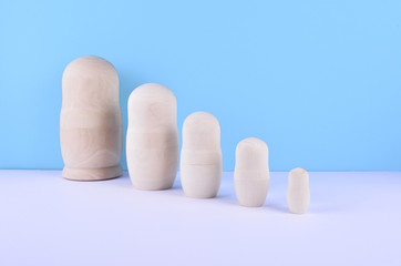 Set of russian dolls on blue background.