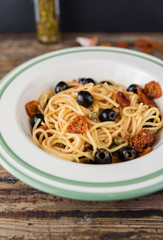 Spaghetti with olives and sun dried tomatoes